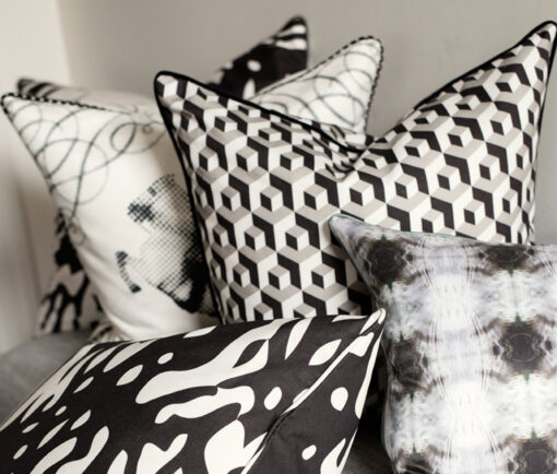 Pillows arranged on bench - Grabado in Carbon, Echo, Jinete, Cubo in Carbon/Paloma/Crema